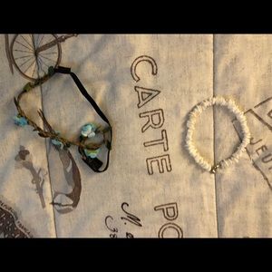 A blue head piece and a white shell bracelet
